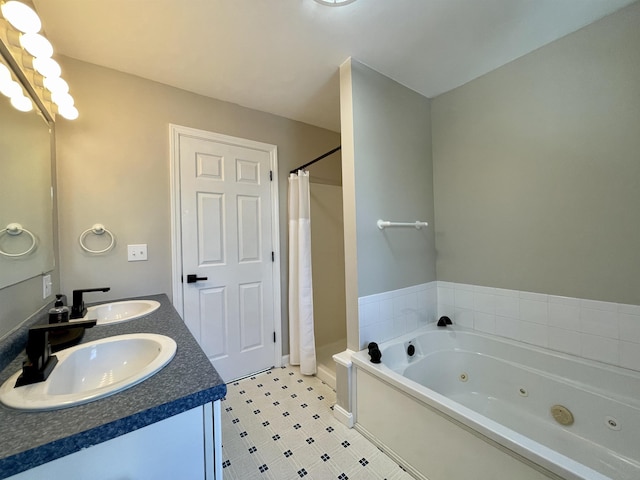 bathroom featuring vanity and plus walk in shower