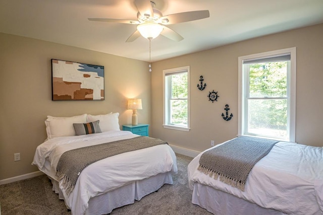 bedroom featuring ceiling fan and carpet flooring