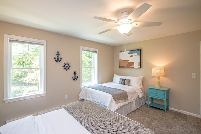 bedroom featuring ceiling fan and carpet floors