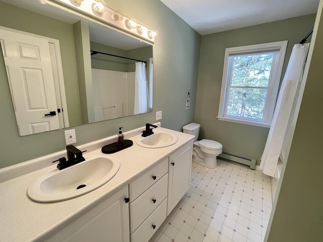 bathroom featuring baseboard heating, vanity, toilet, and walk in shower