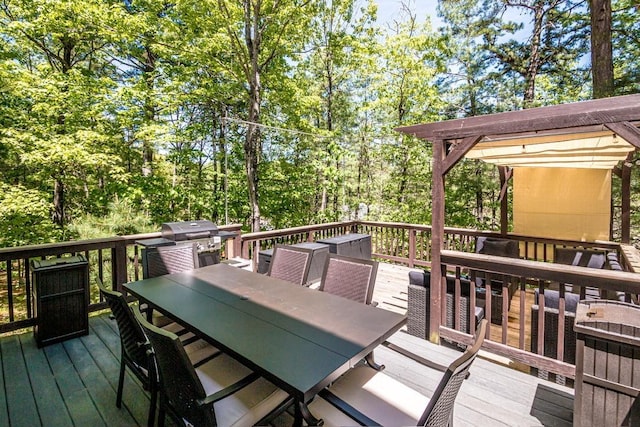 wooden deck featuring a grill