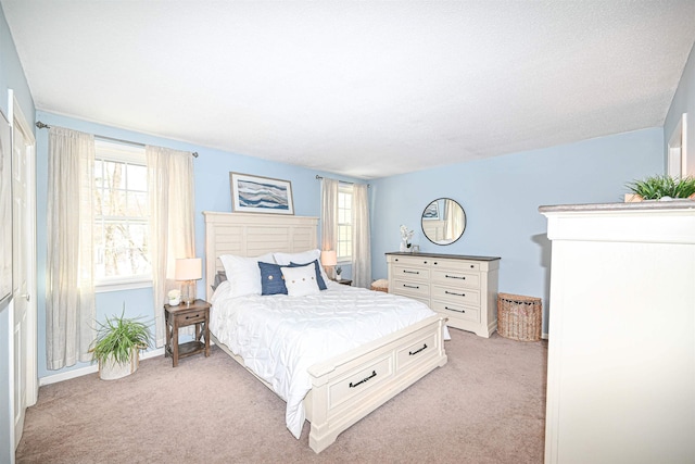 bedroom featuring light carpet