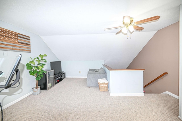 living area featuring lofted ceiling and carpet flooring