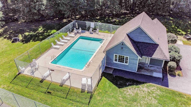 view of pool with a yard and a patio area