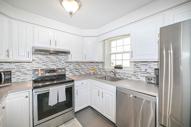 kitchen featuring white cabinetry, sink, and appliances with stainless steel finishes