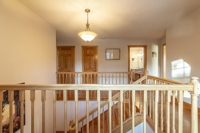 hallway featuring a textured ceiling