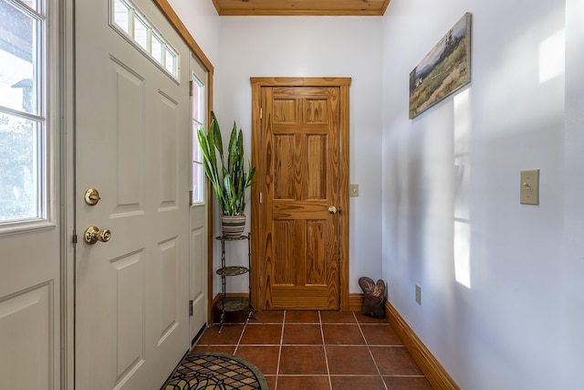 foyer with dark tile patterned floors