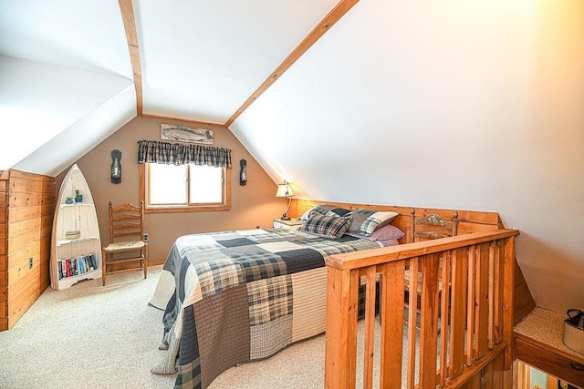 bedroom with vaulted ceiling and carpet floors