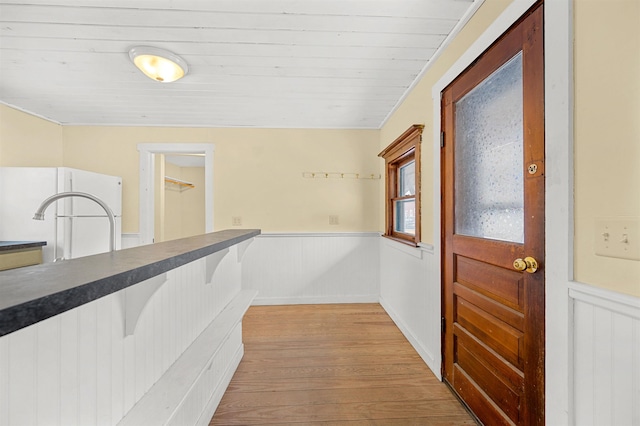 interior space featuring wooden ceiling and light hardwood / wood-style floors