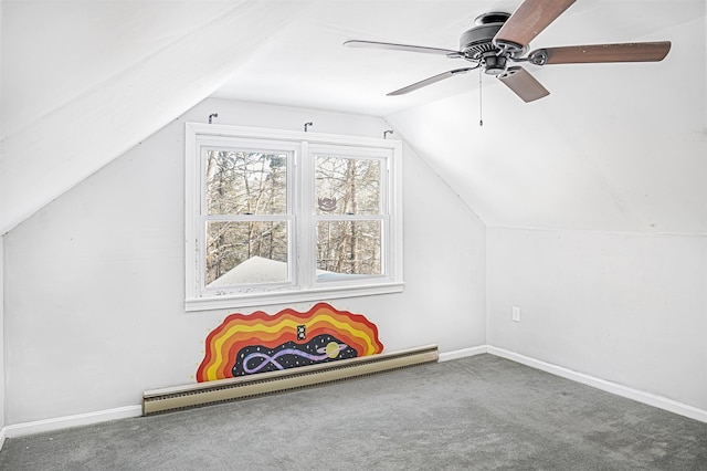 bonus room with a baseboard heating unit, vaulted ceiling, and carpet flooring