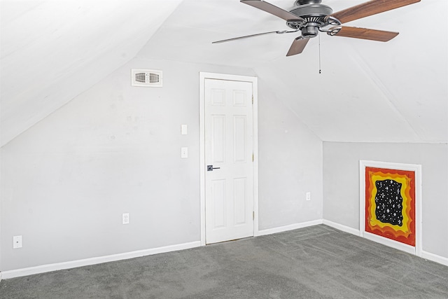 bonus room featuring ceiling fan, lofted ceiling, and dark carpet