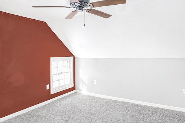 bonus room with ceiling fan, lofted ceiling, and carpet