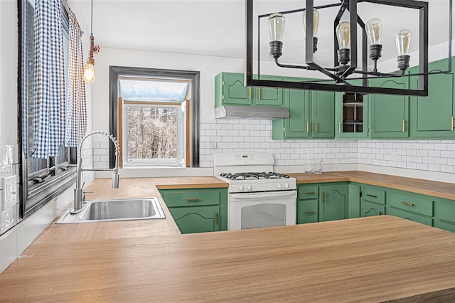 kitchen with green cabinets, white gas range oven, and butcher block countertops