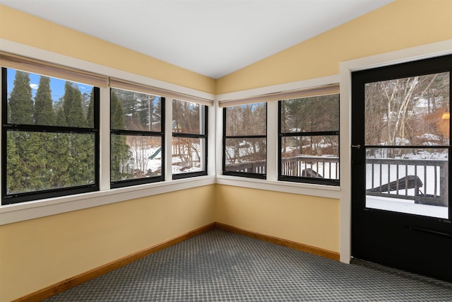 unfurnished sunroom with lofted ceiling