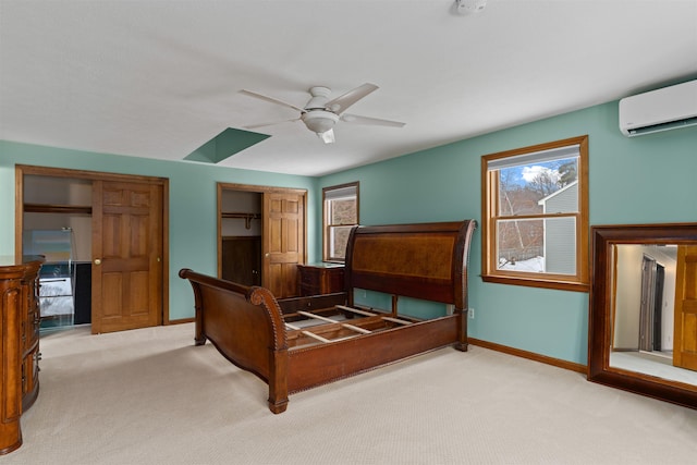 bedroom featuring ceiling fan, a wall mounted AC, and light carpet