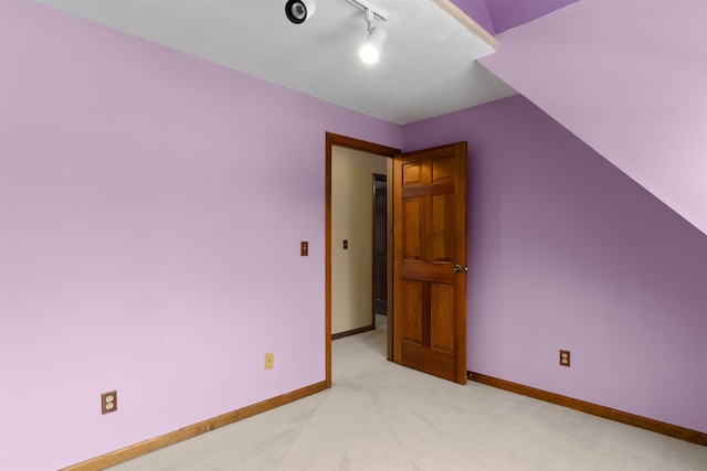 bonus room featuring light colored carpet