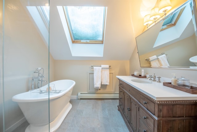 bathroom with vanity, a baseboard heating unit, lofted ceiling with skylight, and a bath