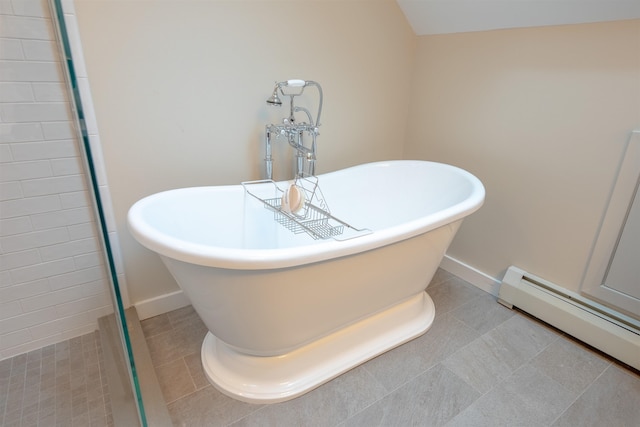 bathroom featuring a baseboard radiator, a tub, and tile patterned floors