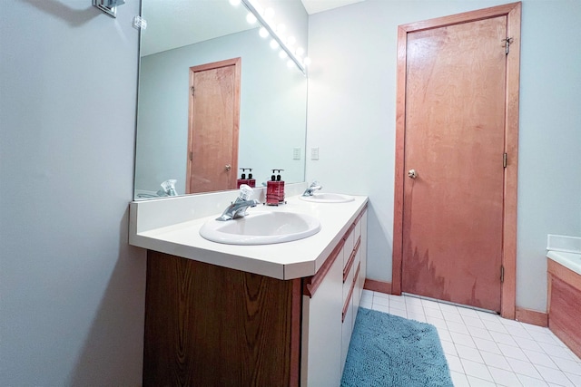 bathroom with vanity and tile patterned flooring