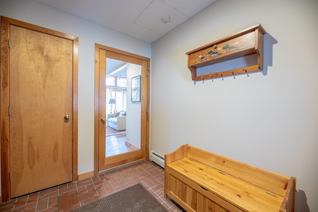 doorway to outside featuring baseboard heating