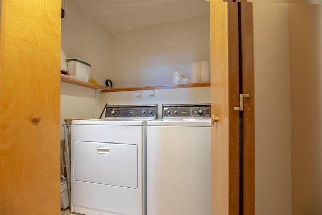 washroom with washing machine and dryer