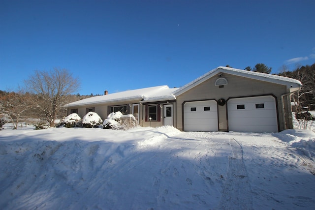 ranch-style house featuring a garage