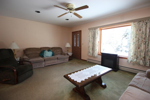 living room with ceiling fan, light carpet, and baseboard heating