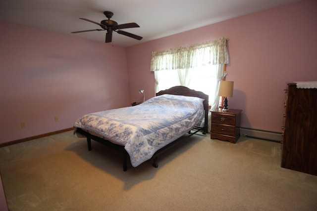 bedroom with a baseboard radiator, light carpet, and ceiling fan