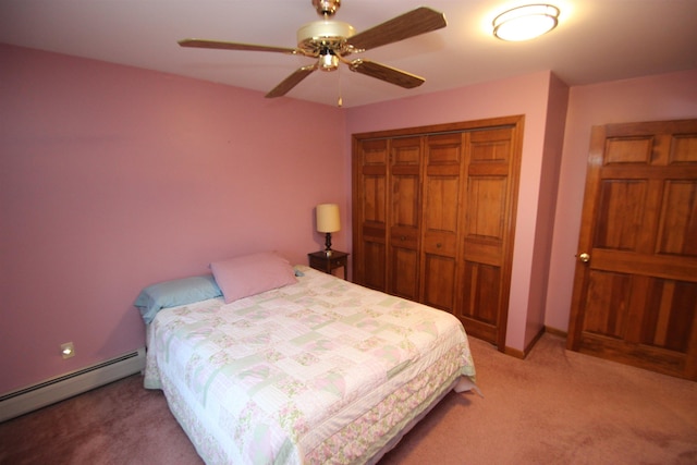 bedroom featuring a baseboard radiator, light carpet, ceiling fan, and a closet