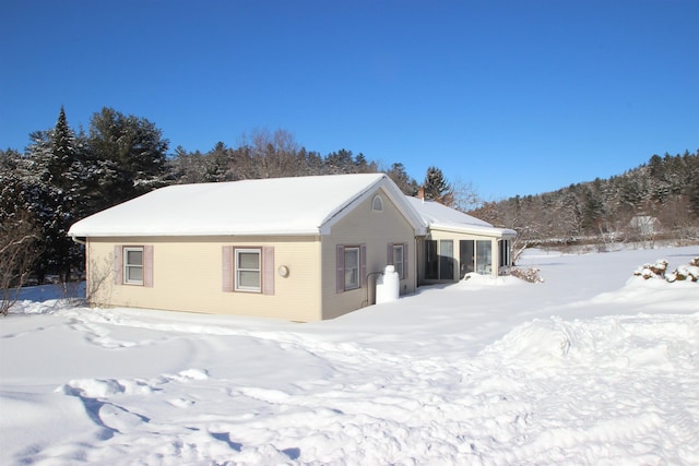 view of snow covered house