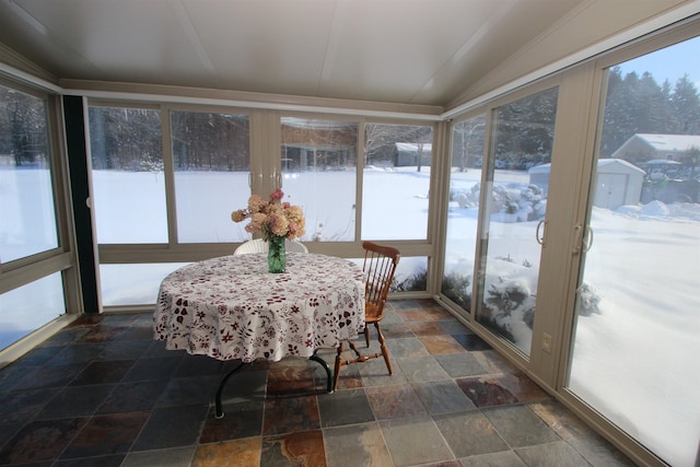 sunroom featuring lofted ceiling