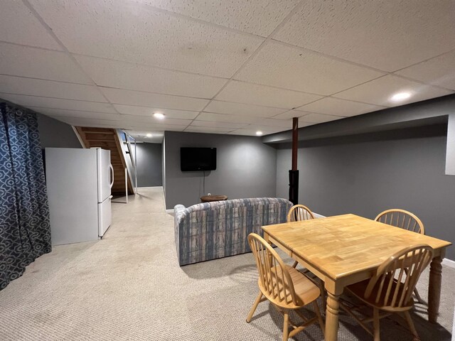 dining area with a drop ceiling