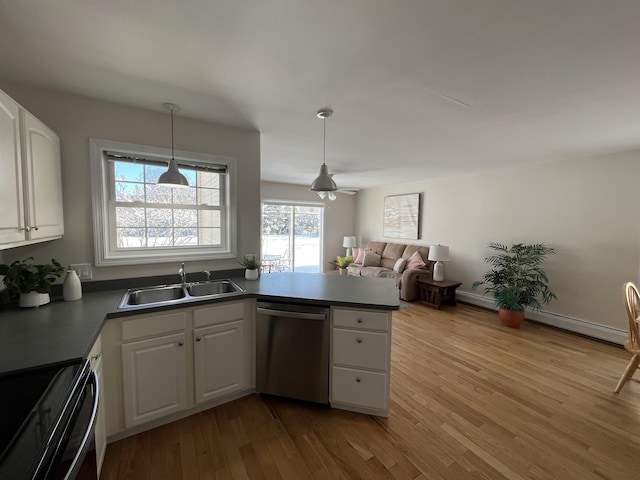 kitchen featuring pendant lighting, sink, white cabinets, stainless steel dishwasher, and black range with electric stovetop