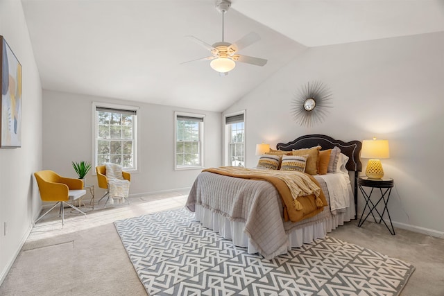 bedroom with ceiling fan, lofted ceiling, and light carpet