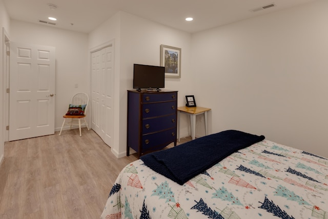 bedroom featuring a closet and light hardwood / wood-style flooring