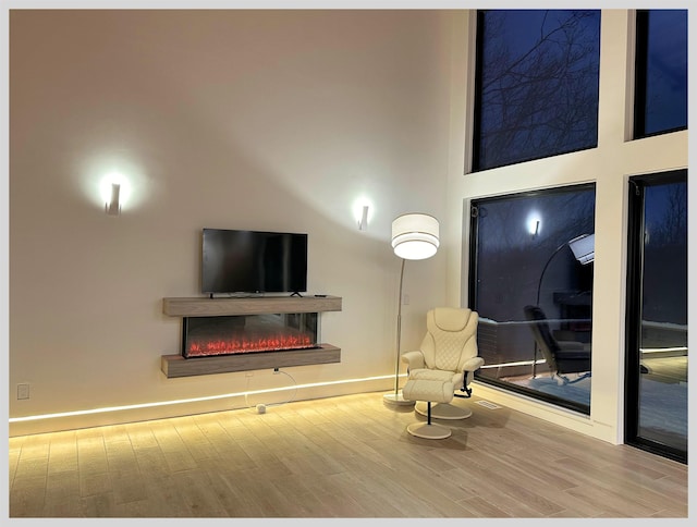 sitting room with hardwood / wood-style floors