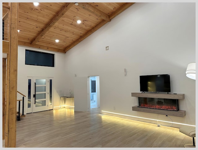 living room featuring wood ceiling, beam ceiling, and light wood-type flooring