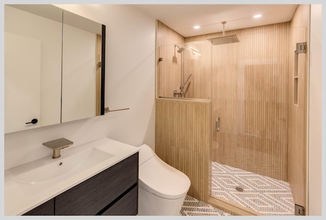 bathroom with vanity, toilet, and an enclosed shower