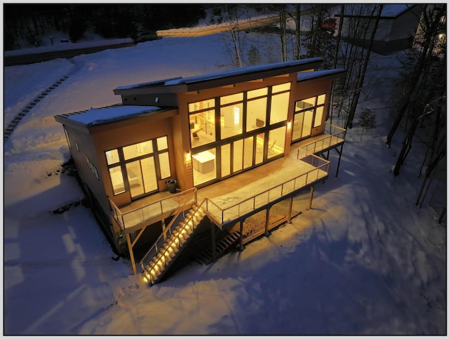 view of snow covered house