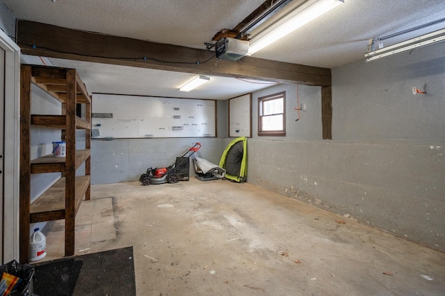 basement featuring a textured ceiling