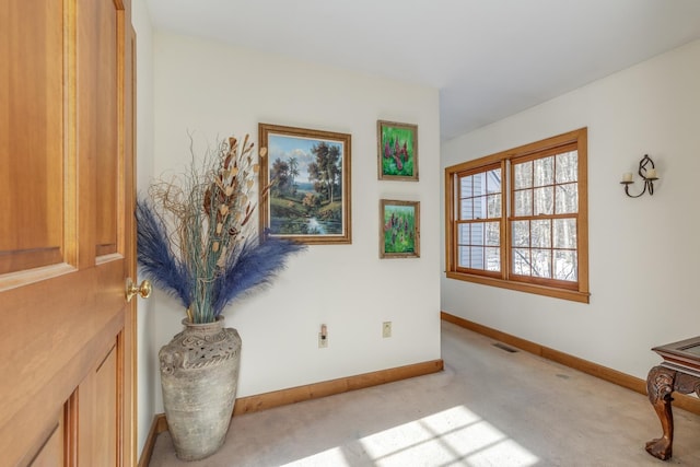 living area with light colored carpet