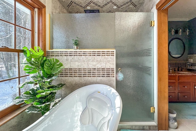 bathroom featuring an enclosed shower and sink