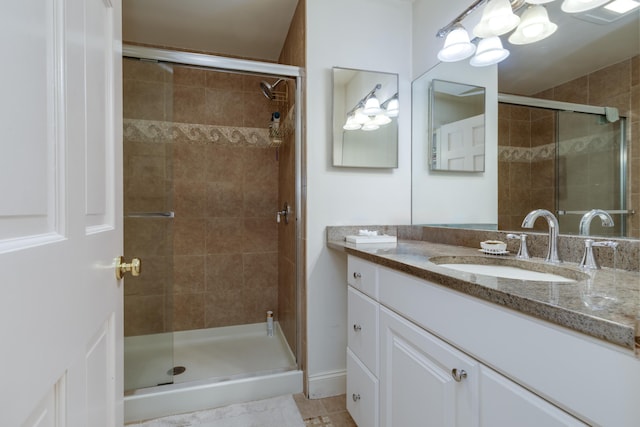 bathroom with vanity and walk in shower