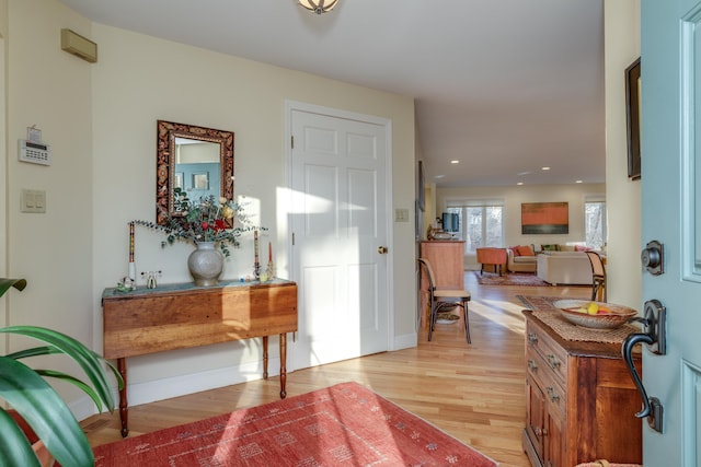 foyer entrance with light hardwood / wood-style floors