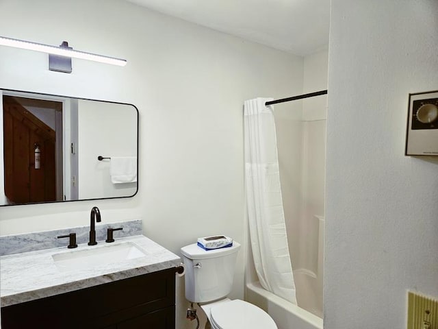 full bathroom featuring vanity, shower / bath combo, and toilet