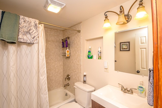 full bathroom with vanity, shower / bath combo, and toilet