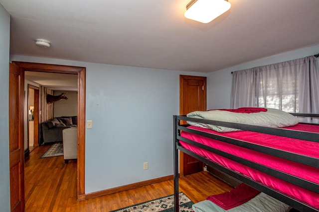 bedroom with hardwood / wood-style floors