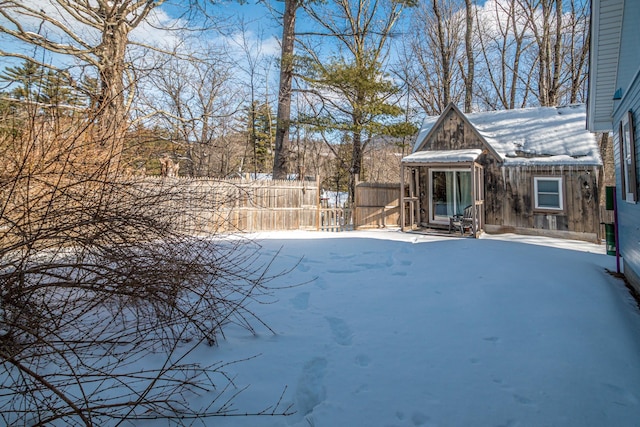 view of yard layered in snow