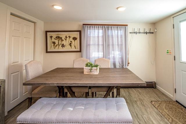 dining area featuring plenty of natural light and hardwood / wood-style floors