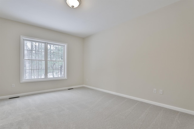 unfurnished room with carpet flooring